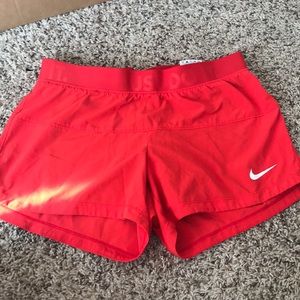 Red Nike dri fit compression shorts